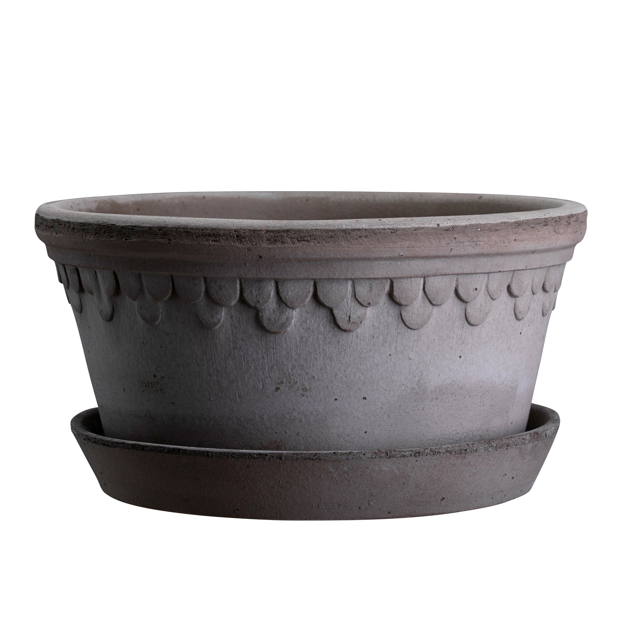 Wide grey ceramic planter with decorative pattern and matching saucer on a white background