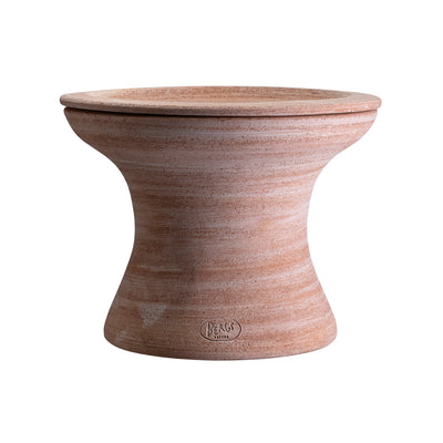 Raw terracotta Bergs Potter planter with matching saucer on top on a white background