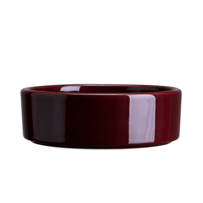 Maroon glaze-finish ceramic saucer on a white background