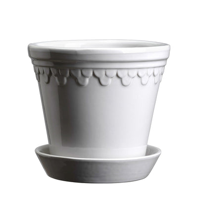 White glaze-finish ceramic Bergs Potter pot with matching saucer