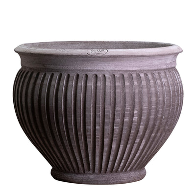 Large, bulbous, ribbed Bergs Potter ceramic planter on a white background