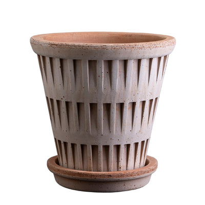 Terracotta Bergs potter pot with a textured design and matching saucer on a white background