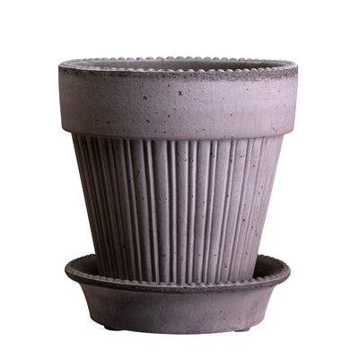 Gray textured Bergs Potter planter with matching saucer on a white background