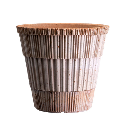 Two-tone ceramic Bergs Potter planter with ribbed texture on a white background