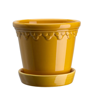 Yellow glaze-finish ceramic Bergs Potter pot with decorative rim and matching saucer