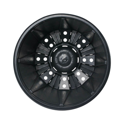 Top-down view of interior of black plastic pot with drainage holes