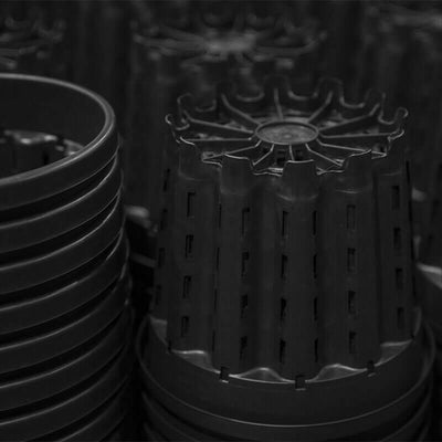 Stacks of Pasquini & Bini Super Ercole Advanced Air-Pruning Containers. Some upright, some upside down.